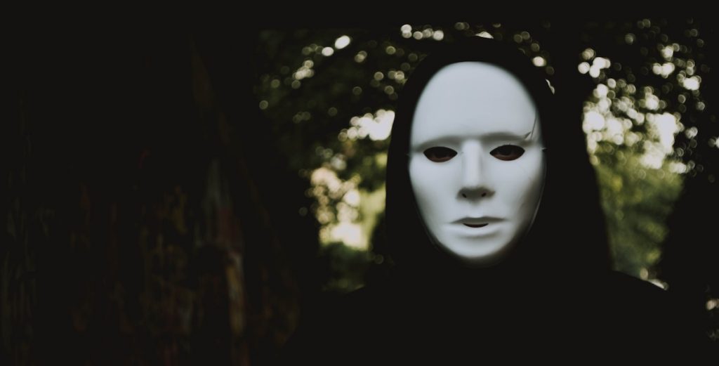 masks and metaphors - horror character with mask