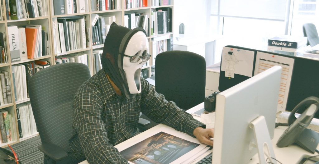 writer with Scream mask